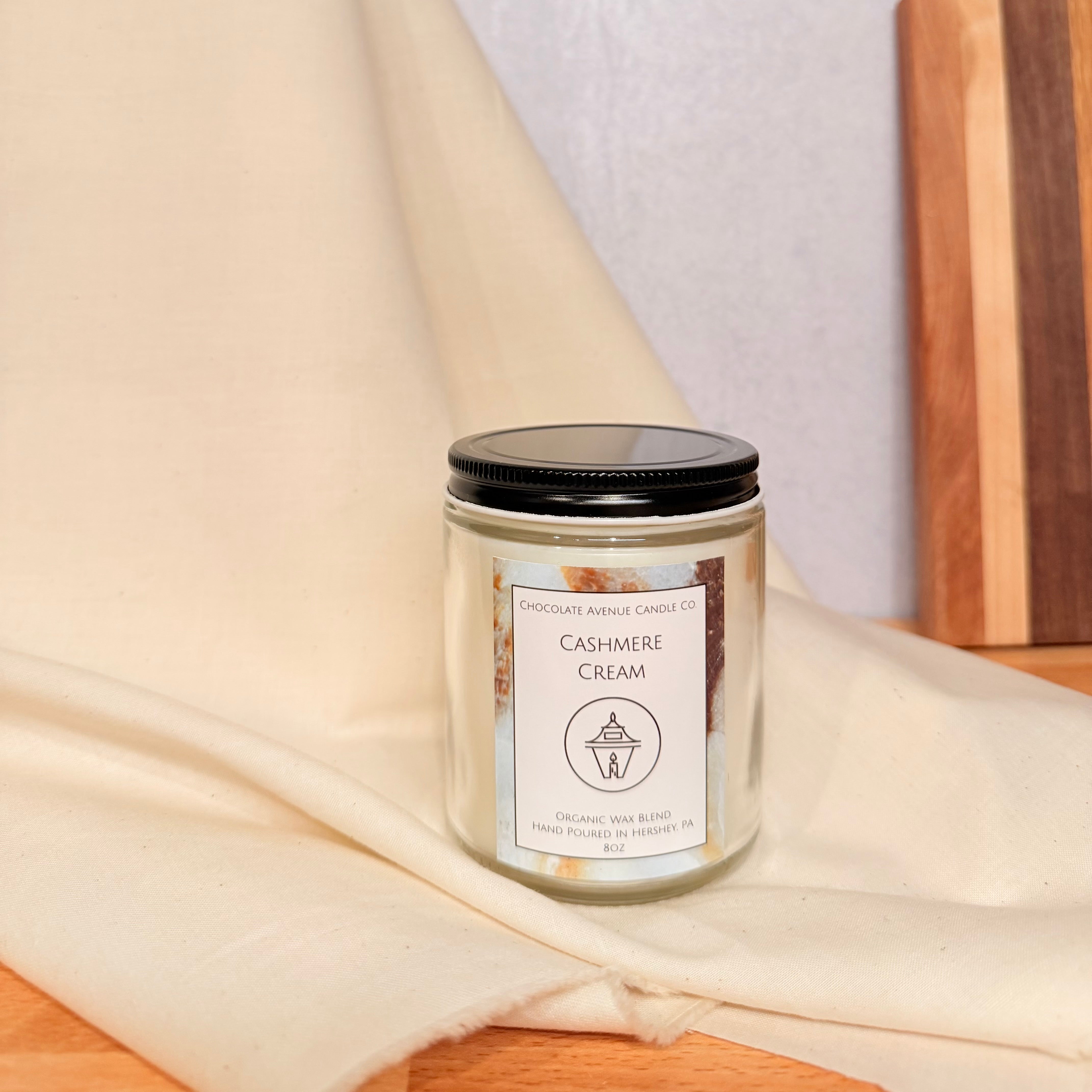 Cashmere Cream candle with jasmine, amber, cotton, and cashmere musk notes.