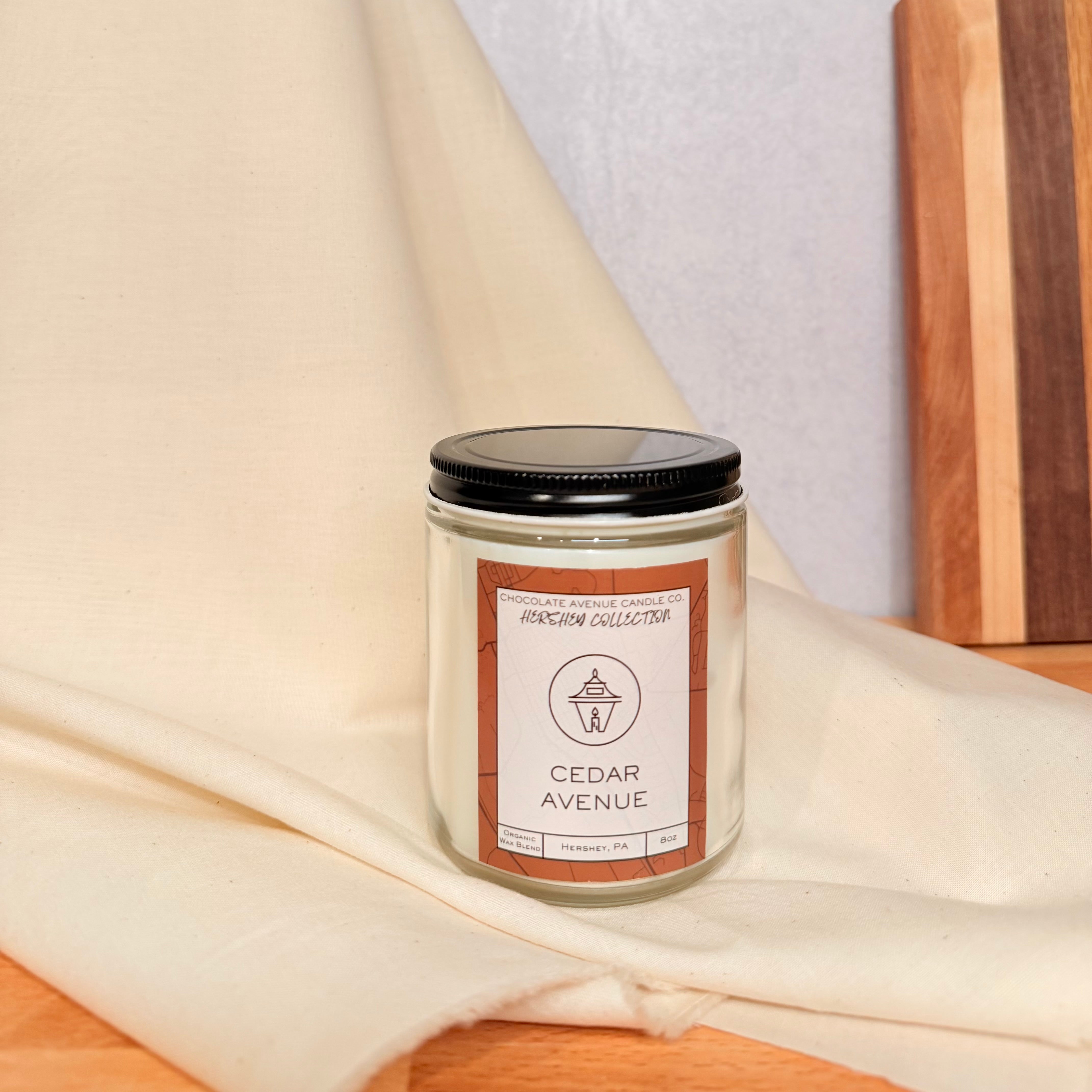 Cedar Avenue candle with bright citron and warm cedarwood fragrance notes.
