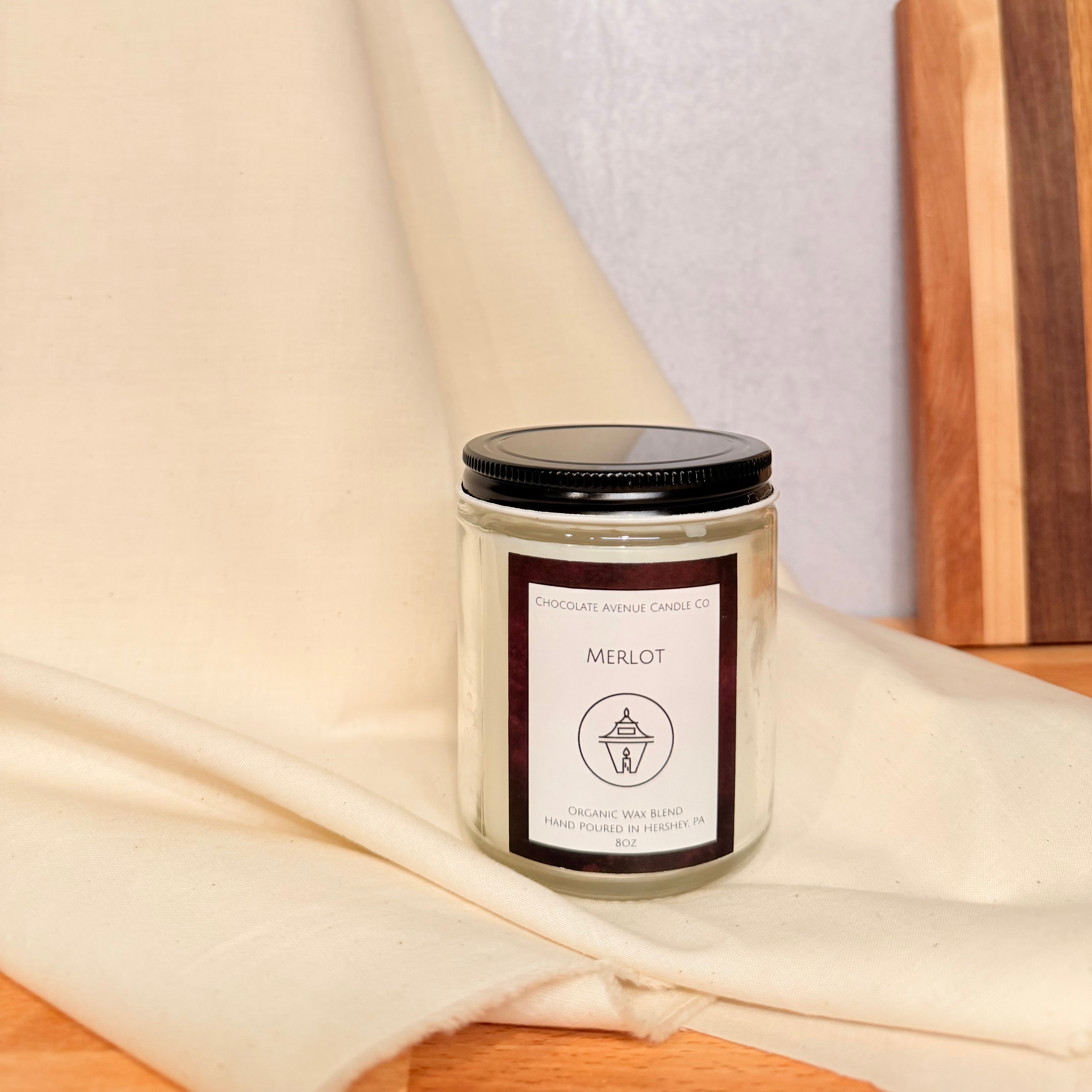 Merlot candle inspired by red wine with dark berry, plum, and oak notes.