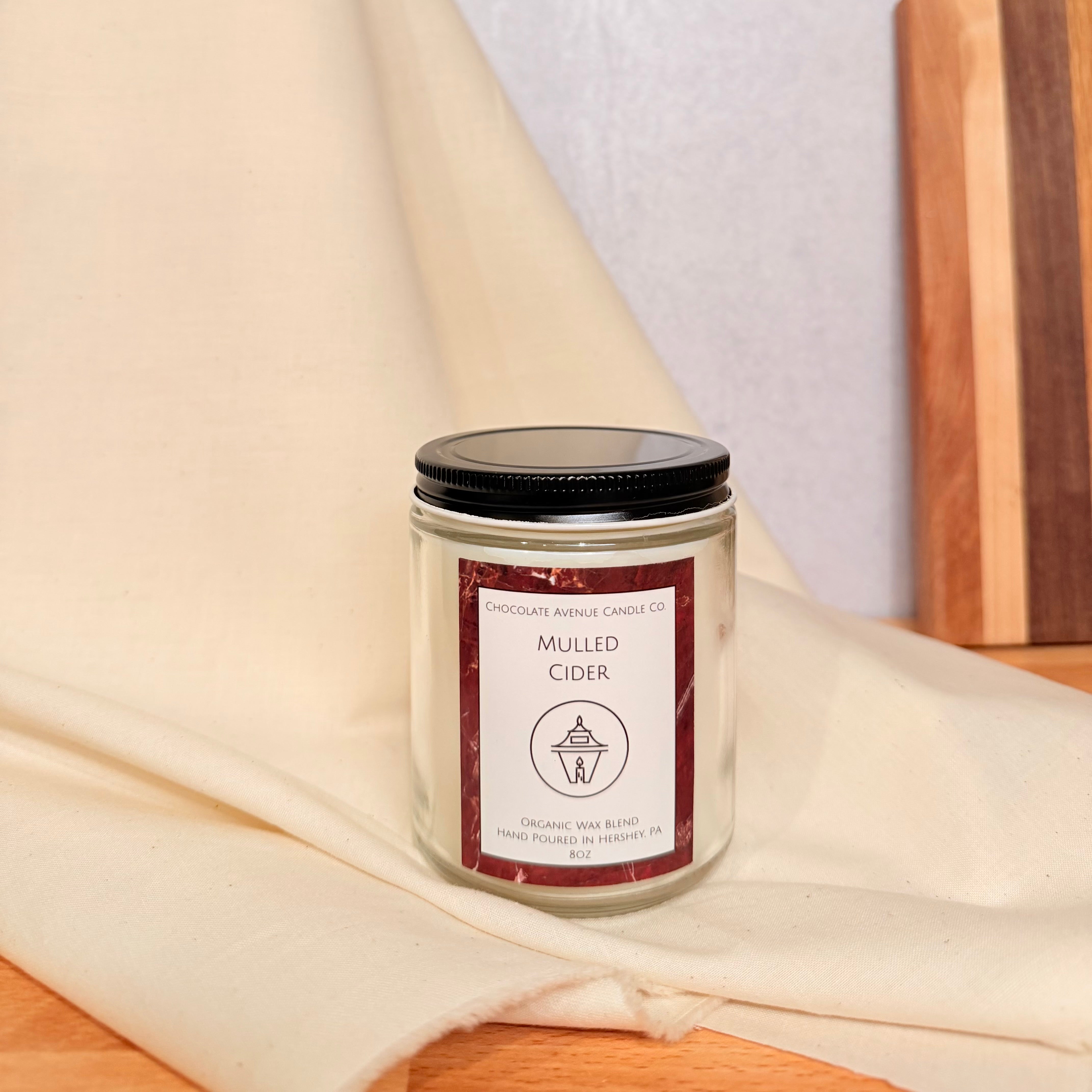 Mulled Cider candle with apple, orange, cinnamon, and clove warm spiced notes.