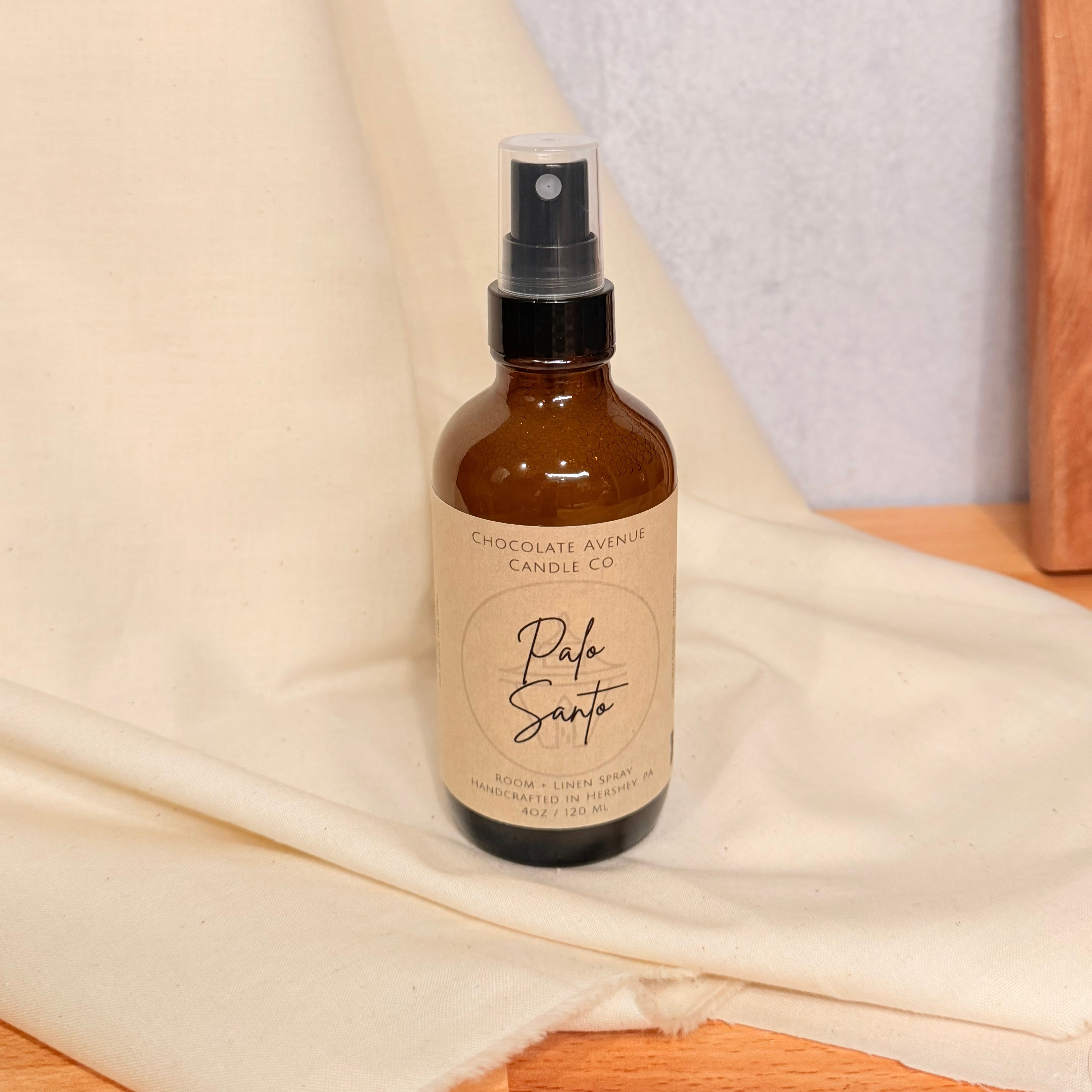 Palo Santo room spray with warm wood and earthy aromatic notes.