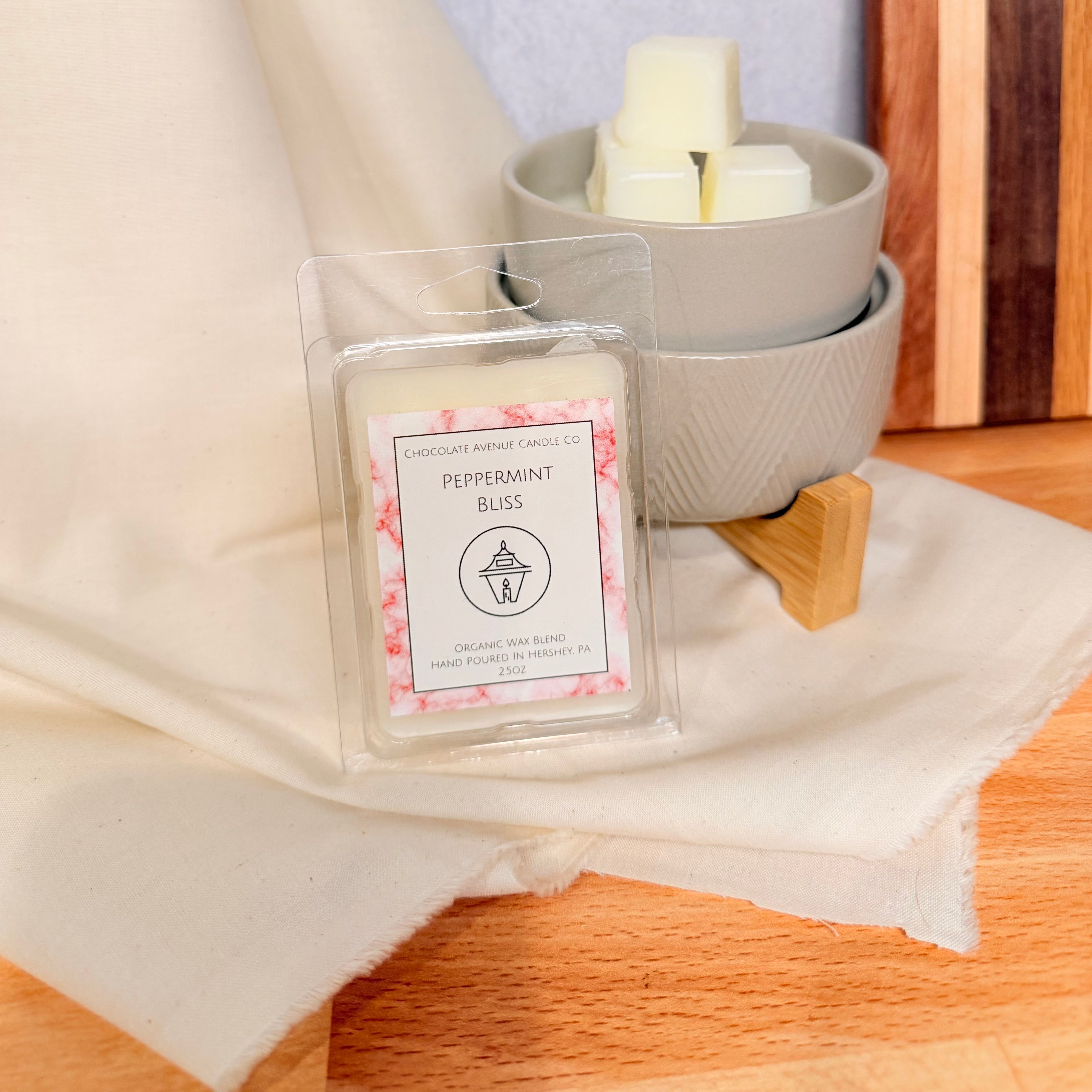 Peppermint Bliss wax melt with crushed candy cane peppermint notes.