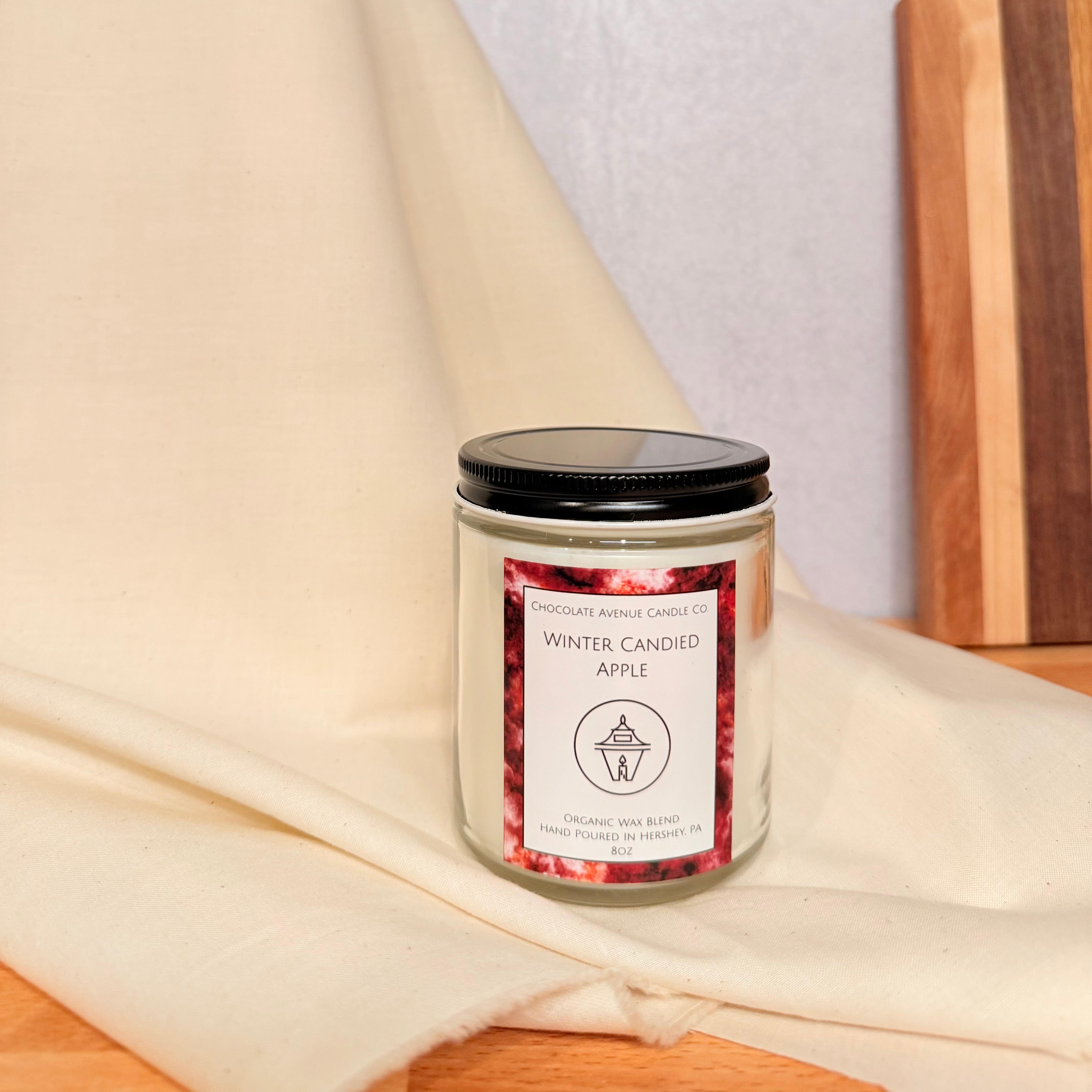 Winter Candied Apple candle with crisp apple, candied orange, and cinnamon notes.