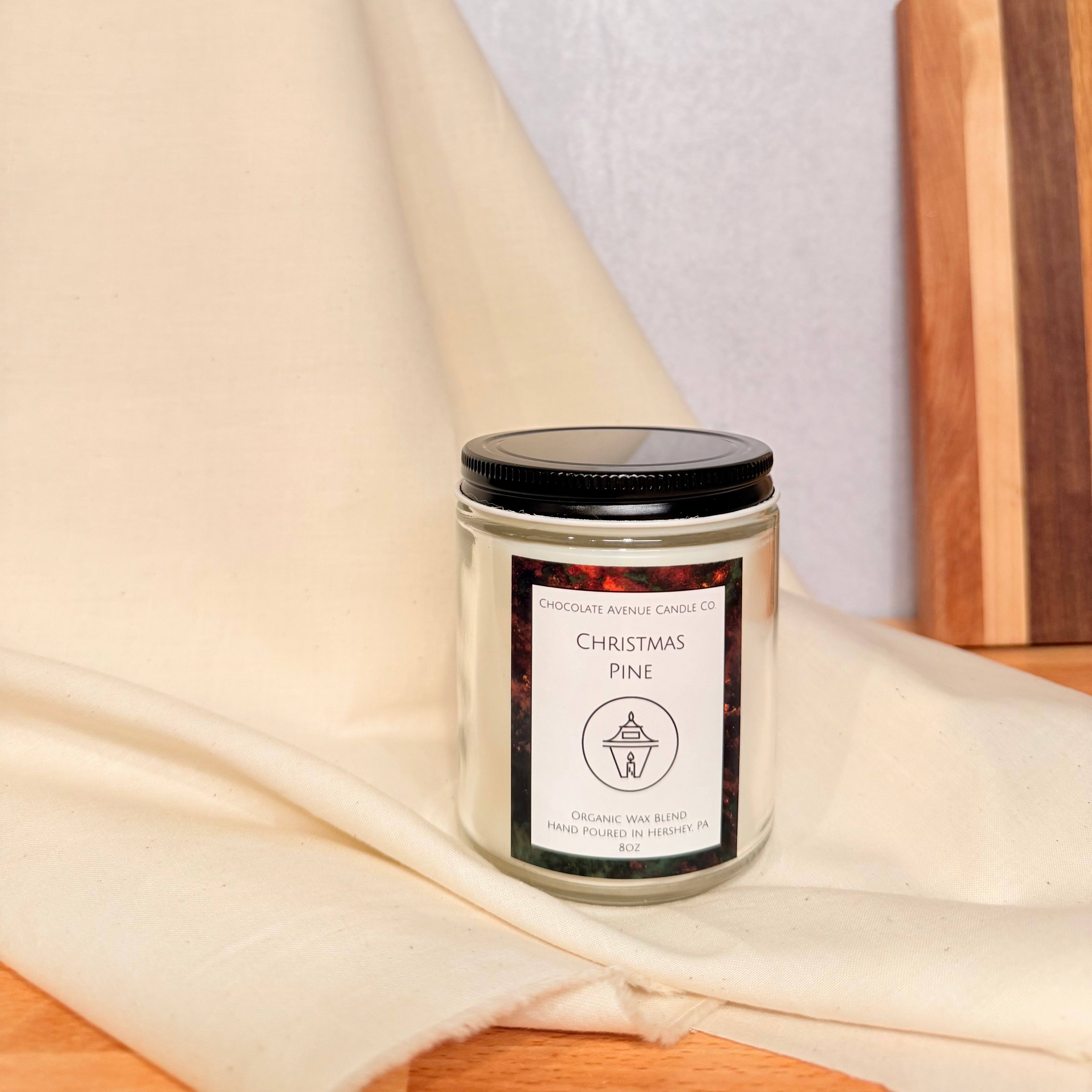 Christmas Pine candle with pine needles, balsam, and cedar notes.