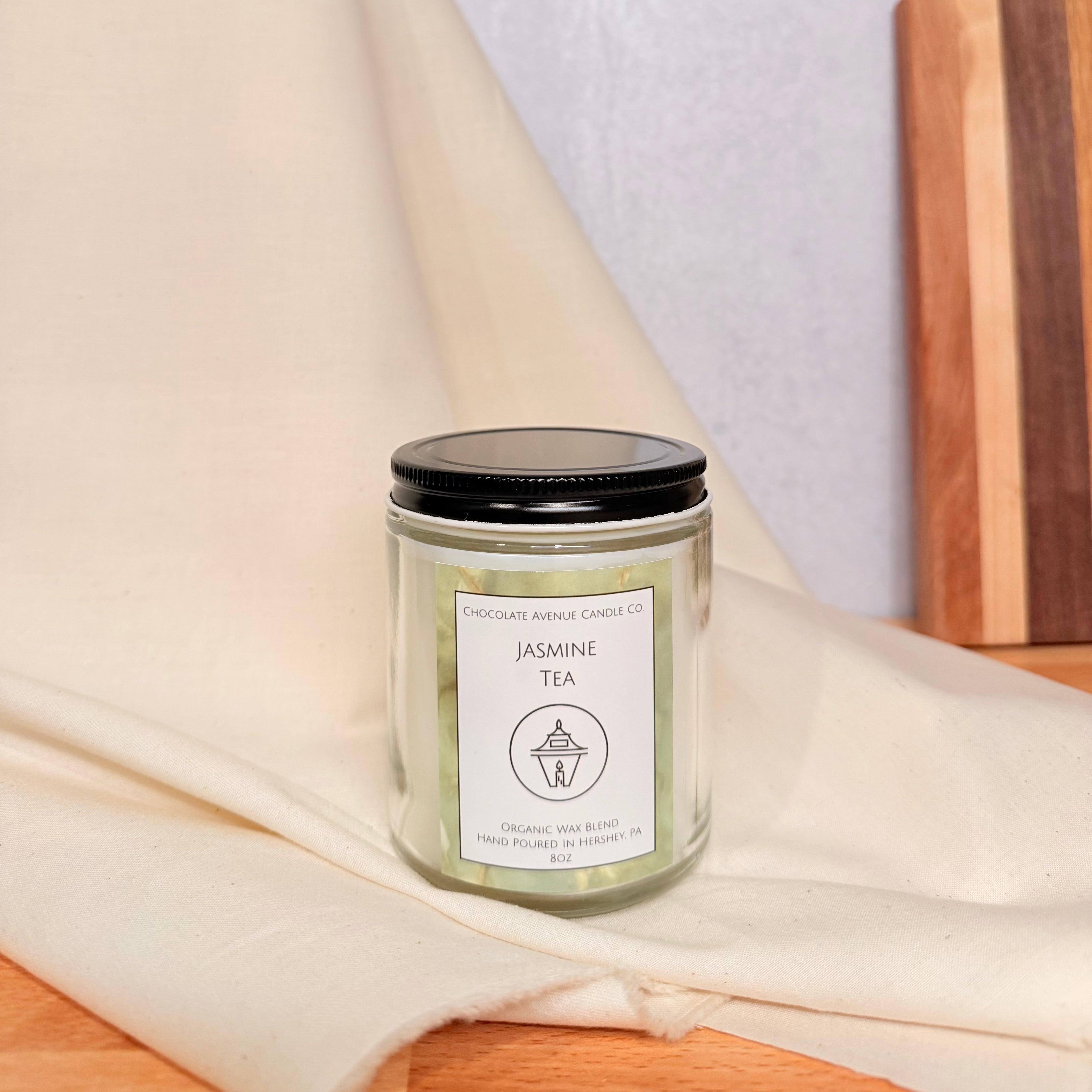 Jasmine Tea candle with lemon, jasmine, and white tea calming fragrance notes.