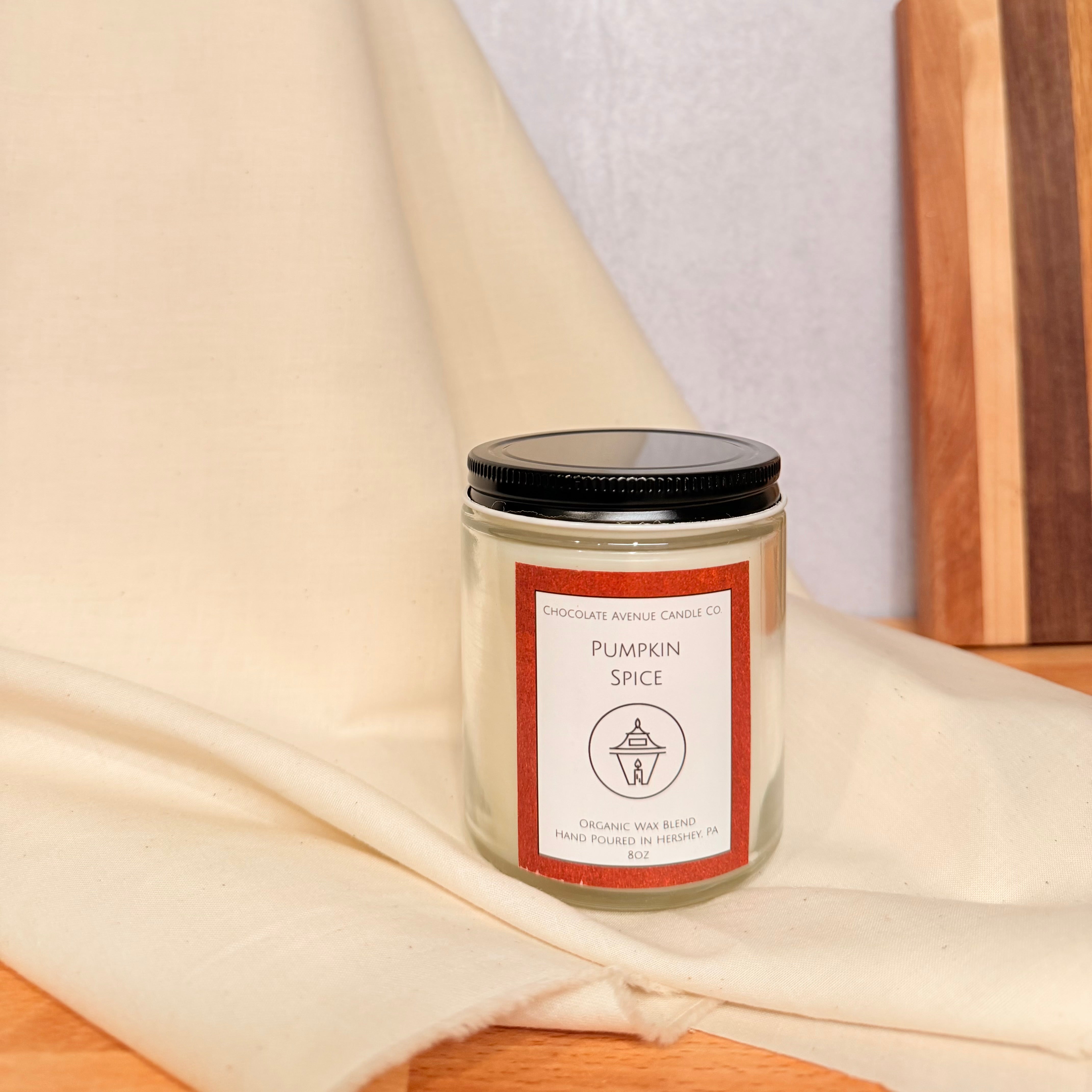 Pumpkin Spice candle with pumpkin, cinnamon, buttercream, and smoked nutmeg fragrance notes.